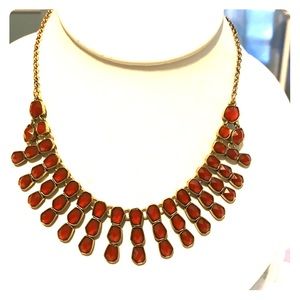 Goldtone necklace with adjustable chain.